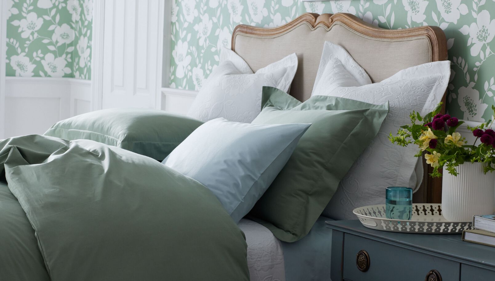 bedroom with green floral wallpaper