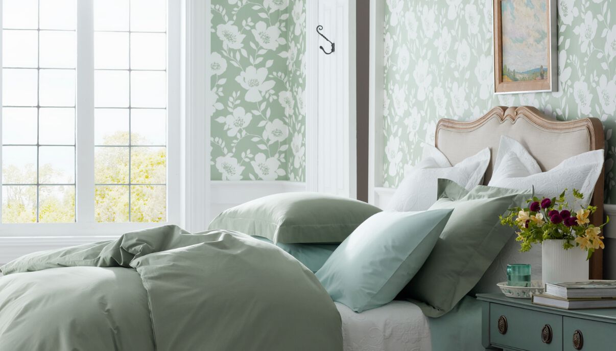 Room with green floral wallpaper